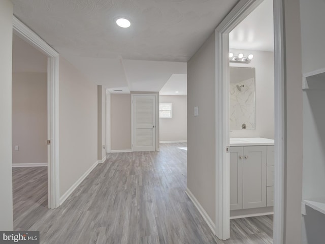 hallway featuring light wood-type flooring