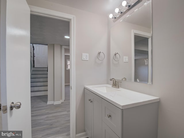 bathroom featuring vanity and hardwood / wood-style flooring