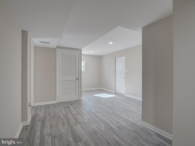 basement featuring light wood-type flooring