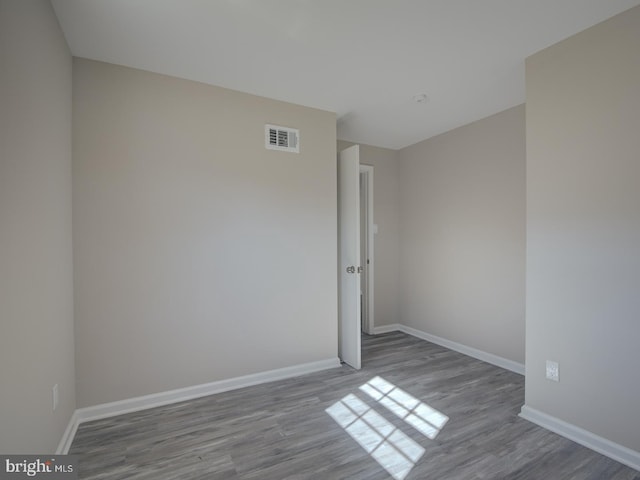 unfurnished room featuring light wood-type flooring