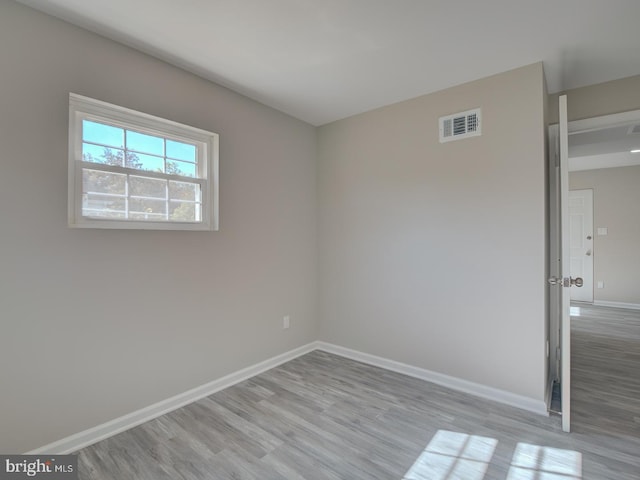 spare room featuring light hardwood / wood-style floors