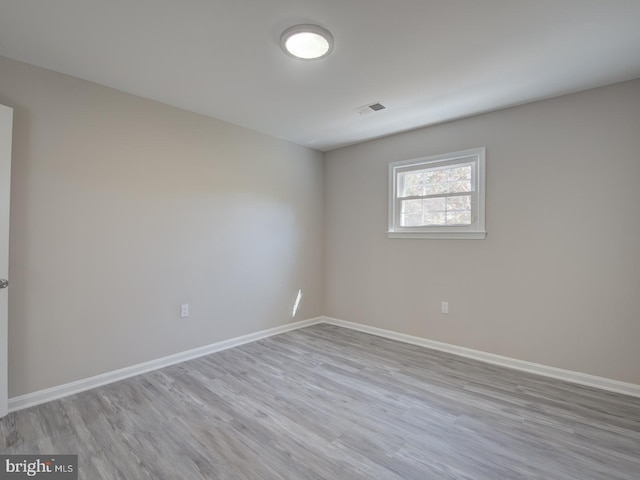 empty room with light wood-type flooring