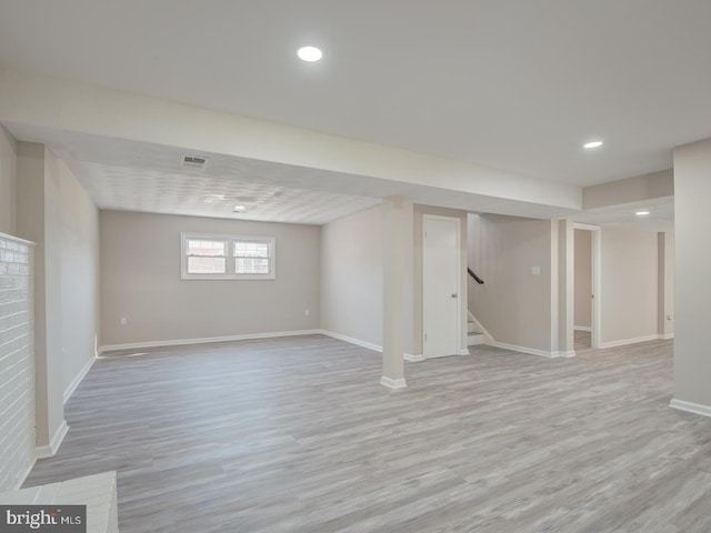 basement featuring light hardwood / wood-style flooring