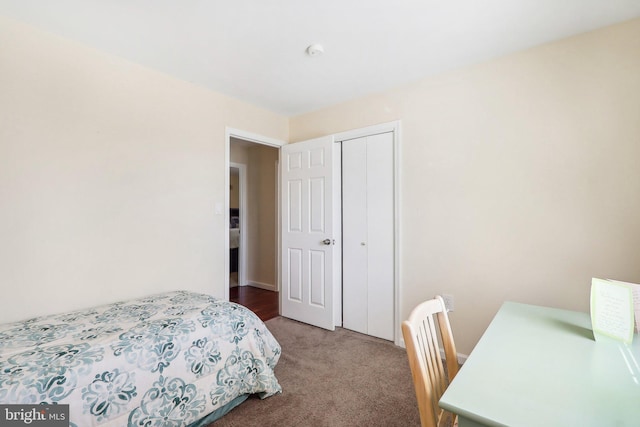 bedroom featuring a closet and carpet