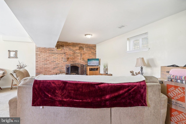 living room with carpet floors and a fireplace