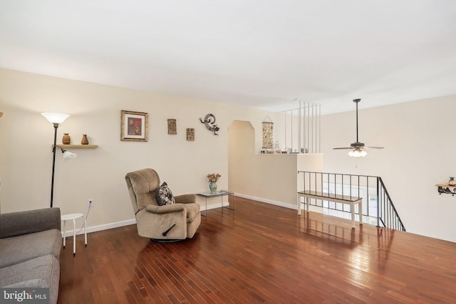 sitting room featuring ceiling fan and dark hardwood / wood-style flooring