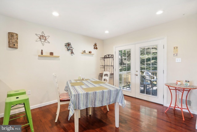 dining area featuring french doors and dark hardwood / wood-style flooring