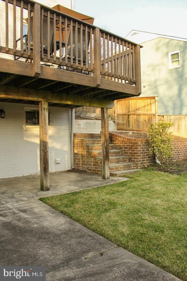 exterior space with a patio area and a deck