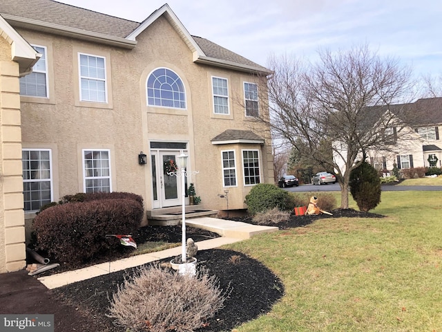 view of front of home with a front yard