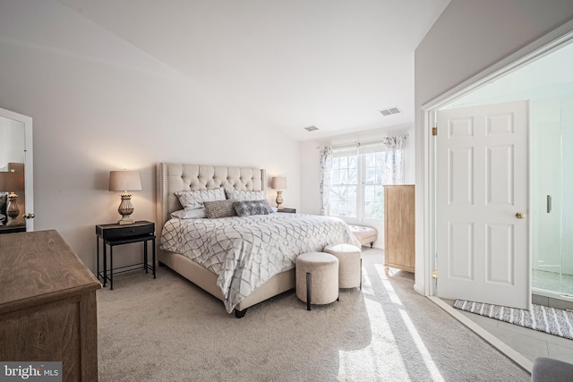 bedroom featuring carpet and lofted ceiling