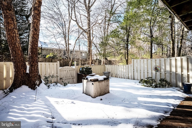 view of yard layered in snow