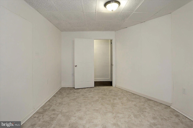 spare room with a drop ceiling