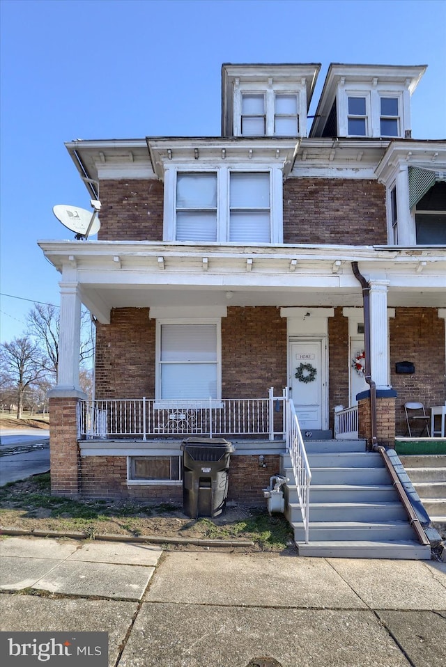 view of property with a porch