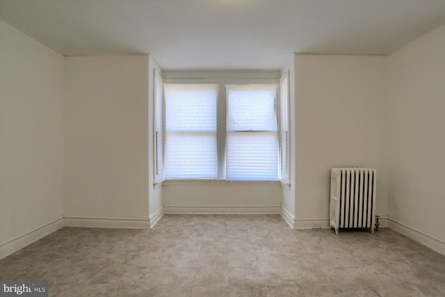 empty room featuring radiator heating unit