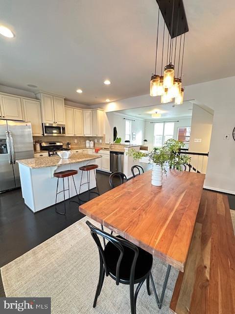 dining area featuring dark hardwood / wood-style flooring