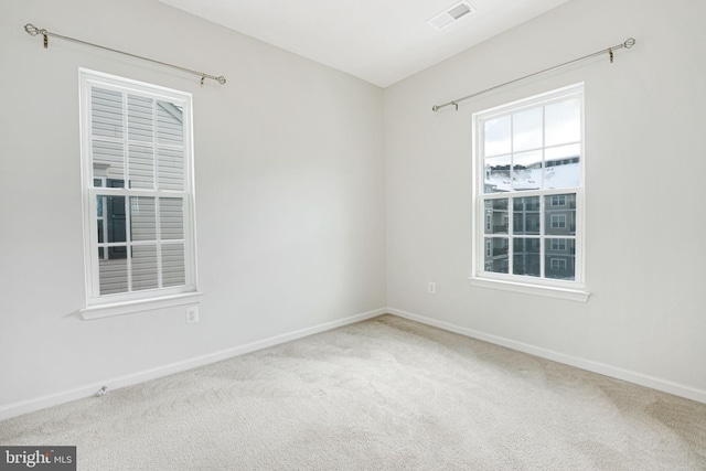 unfurnished room featuring carpet floors