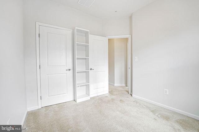 unfurnished bedroom with light carpet