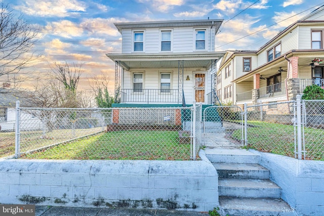 view of front of home featuring a yard and a porch