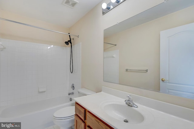 full bathroom featuring toilet, vanity, and  shower combination