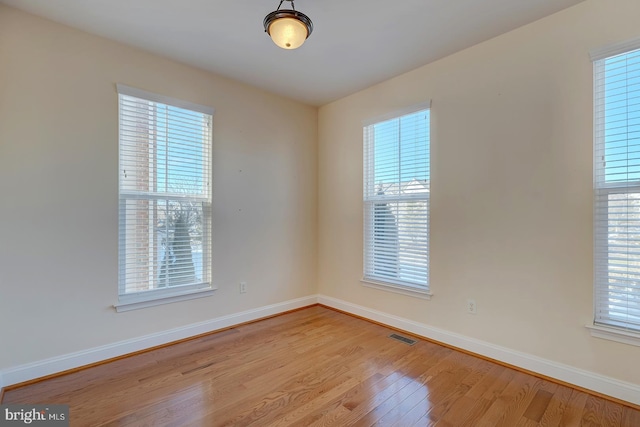 unfurnished room featuring light wood-type flooring