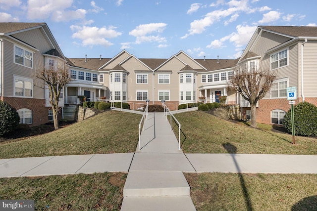 view of community featuring a yard