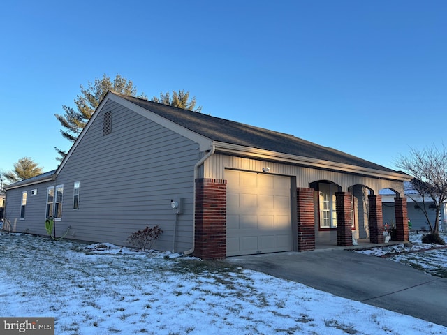 view of front of house with a porch and a garage