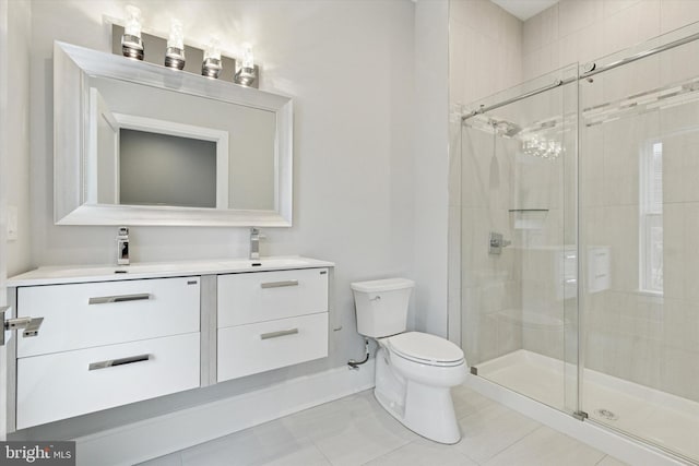 full bath with a stall shower, tile patterned flooring, vanity, and toilet