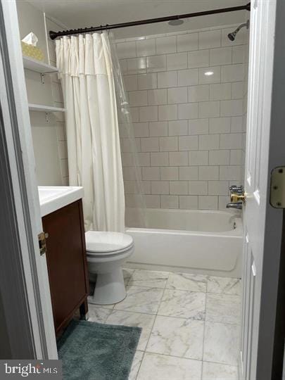 full bathroom featuring vanity, shower / tub combo, and toilet