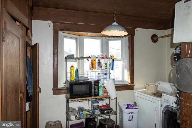 laundry room featuring washer and clothes dryer and wooden ceiling