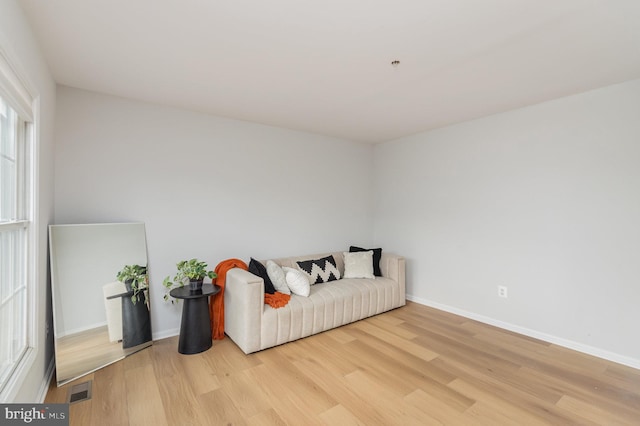 living area with light hardwood / wood-style flooring