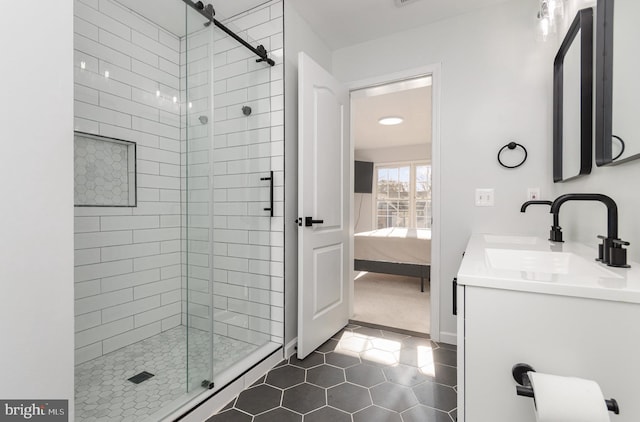 bathroom featuring tile patterned floors, vanity, and an enclosed shower