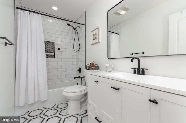 full bathroom with vanity, toilet, and shower / tub combo