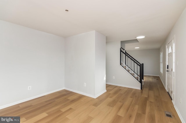 foyer entrance with light wood-type flooring