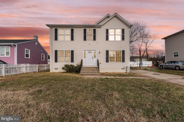 view of front of home with a lawn