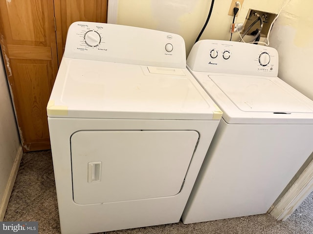 laundry room with washing machine and clothes dryer