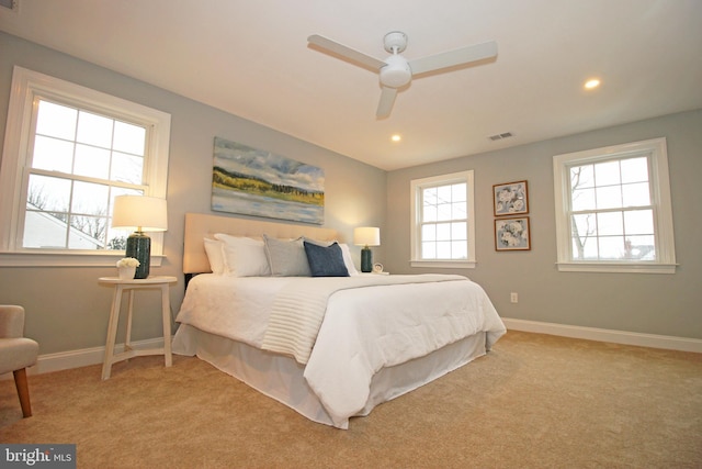 carpeted bedroom with ceiling fan