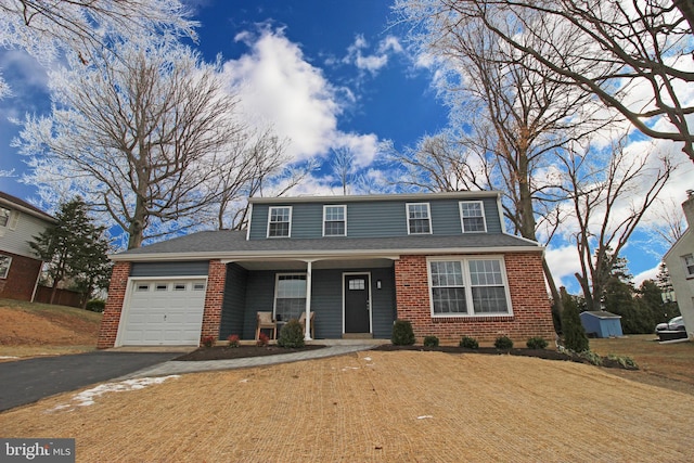 front of property featuring a garage and a porch