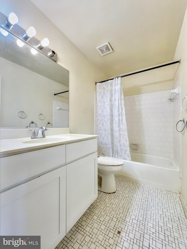 full bathroom with tile patterned floors, vanity, toilet, and shower / tub combo