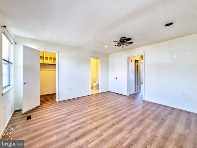 interior space with ceiling fan and light wood-type flooring