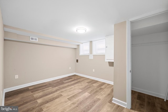 basement featuring wood-type flooring