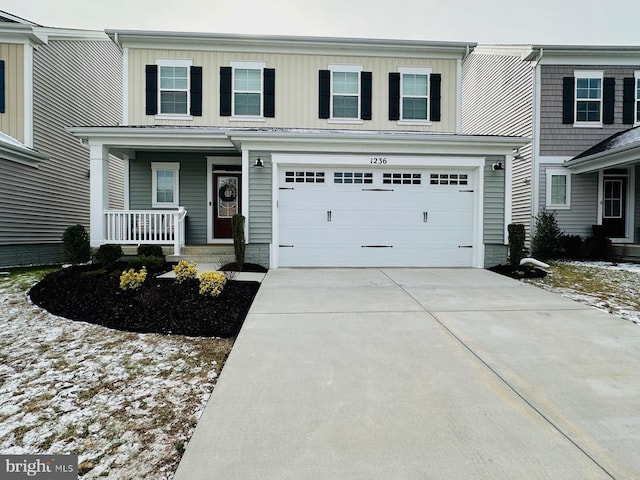 view of front of home with a porch and a garage