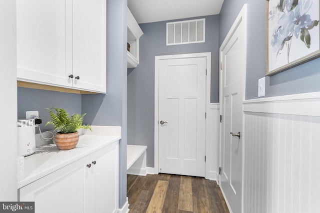 laundry room with dark hardwood / wood-style flooring