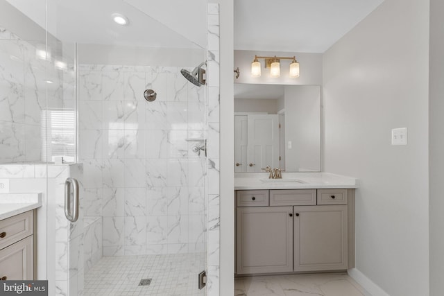 bathroom with walk in shower and vanity