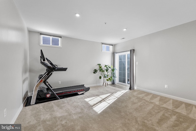 exercise area with light colored carpet