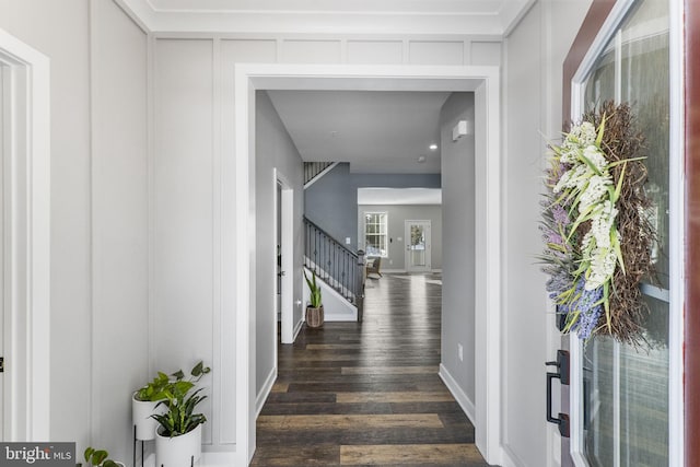 hall with dark hardwood / wood-style flooring