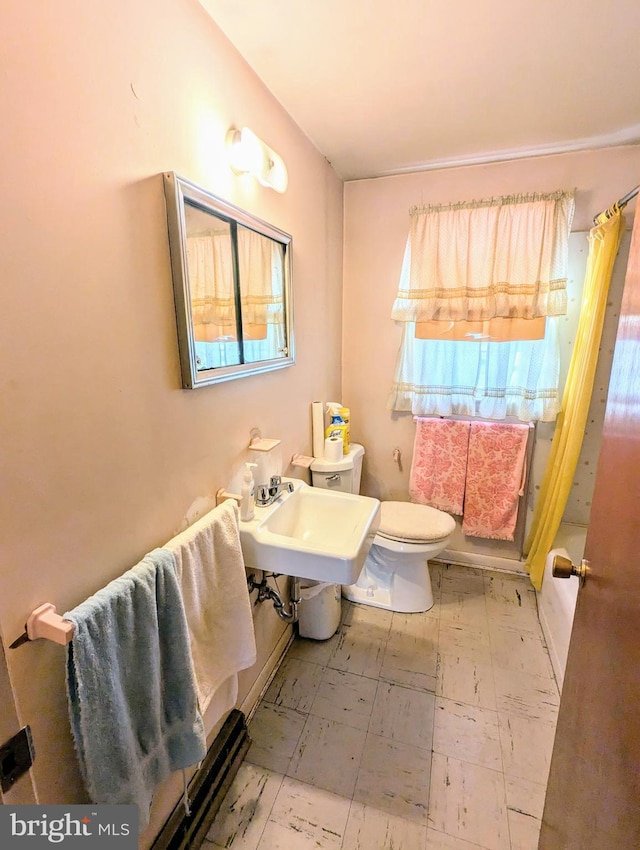 bathroom with toilet and shower / bathtub combination with curtain