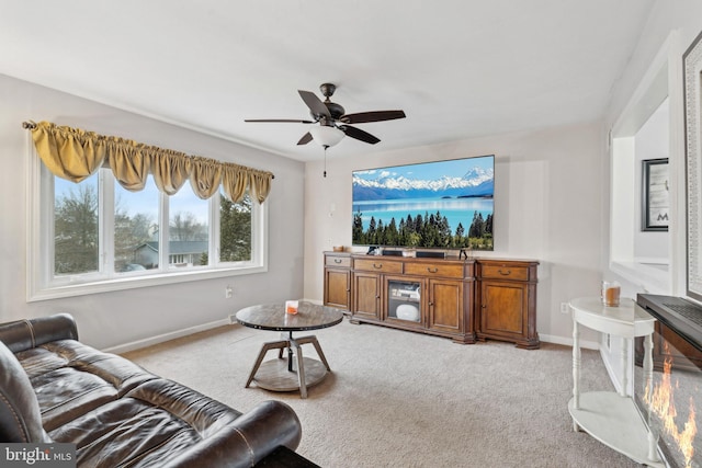 living room featuring ceiling fan and light colored carpet