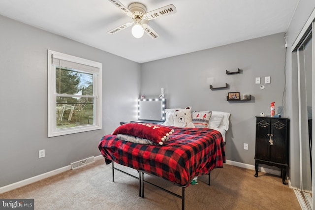 carpeted bedroom featuring ceiling fan