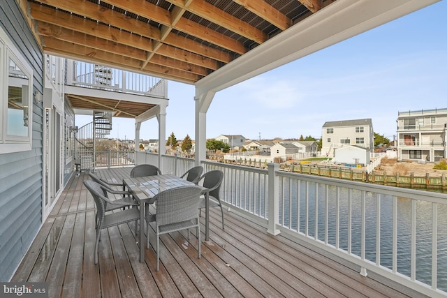 wooden deck with a water view