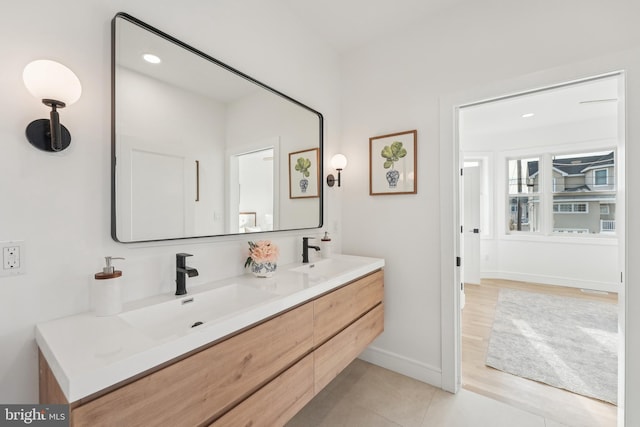 bathroom featuring tile patterned flooring and vanity